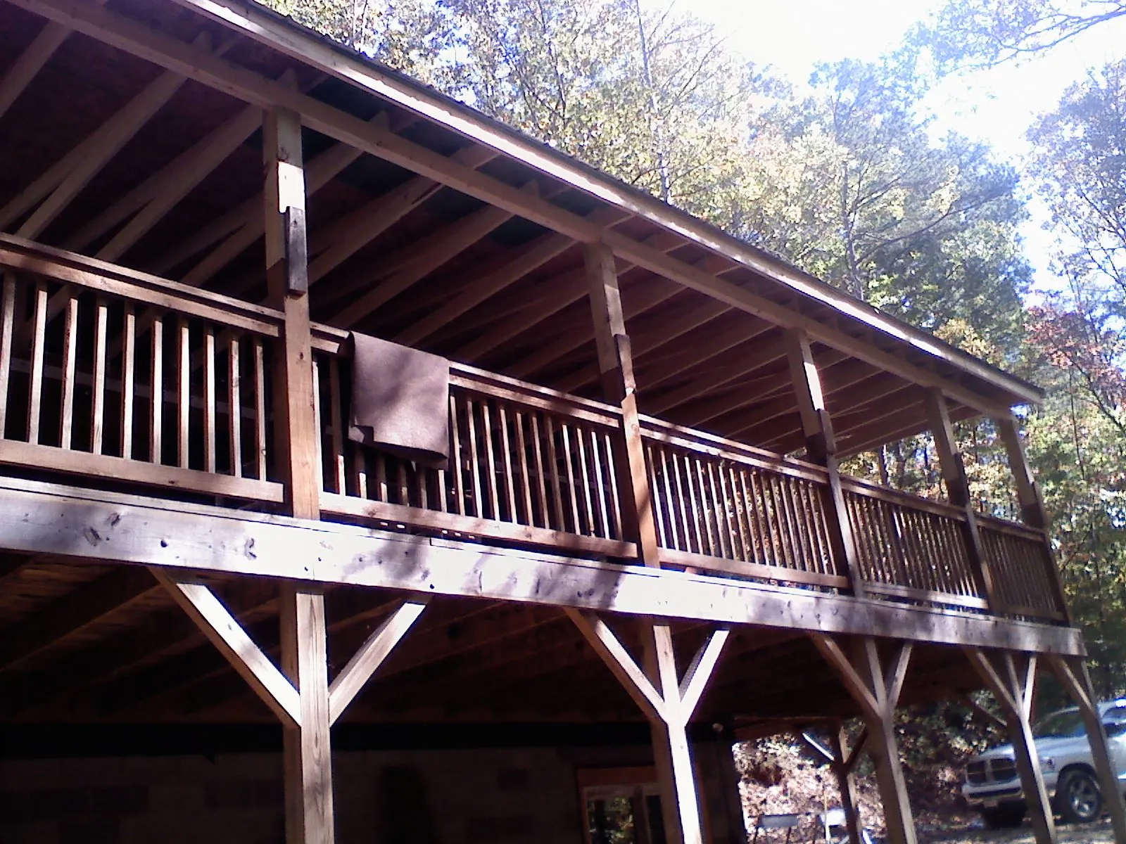 Timber framing under a new elevated porch and deck — Roof Leak Repair in Velva by Roofing Brothers